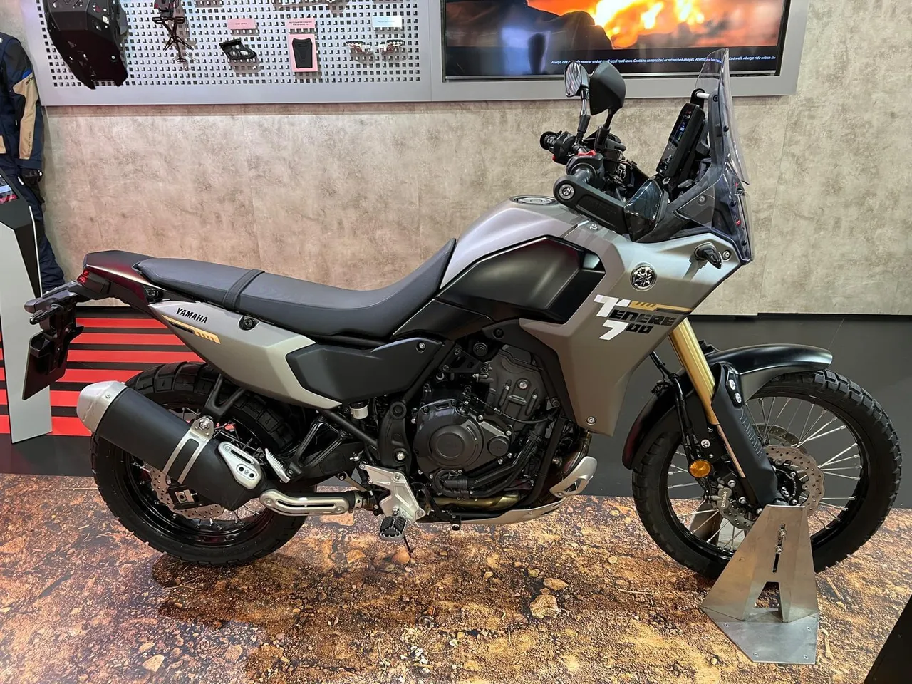 Yamaha Ténéré 700 displayed with a high front mudguard and wire-spoked wheels