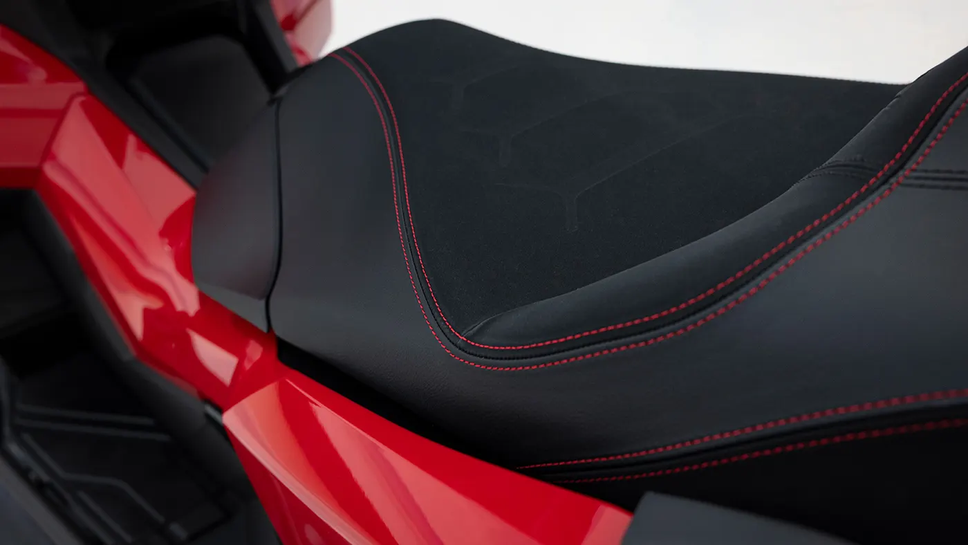 Detail of the Honda ADV350 seat and red bodywork