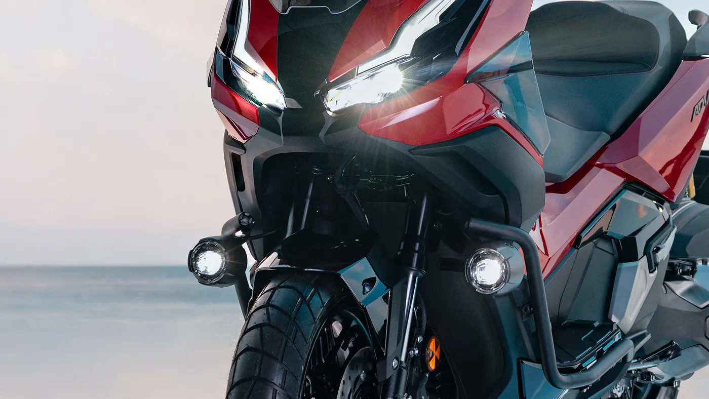 Front detail of the Honda ADV350 headlight, screen and front tyre