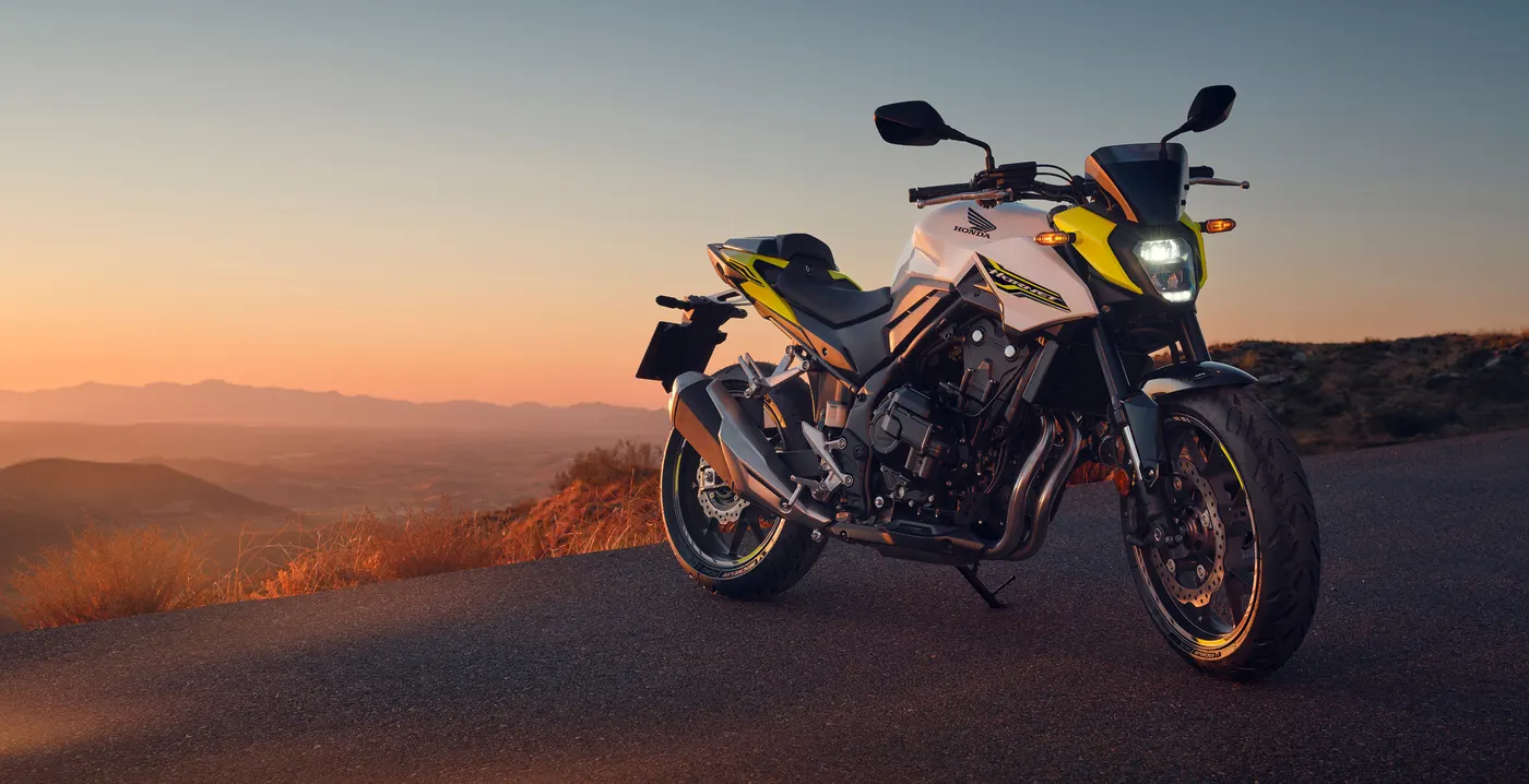 Honda CB500 Hornet being ridden on a road