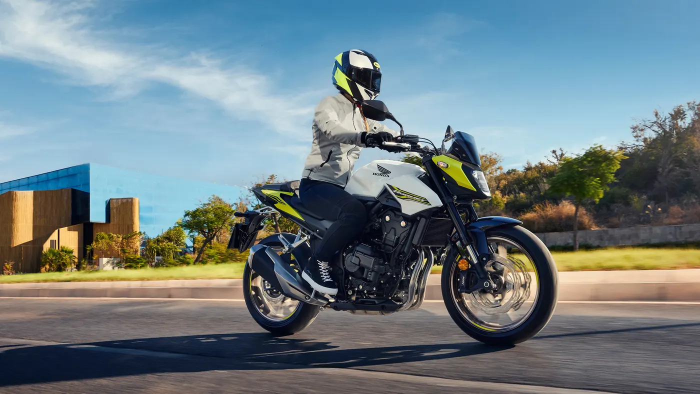 Honda CB500 Hornet with a rider in a bright colourway