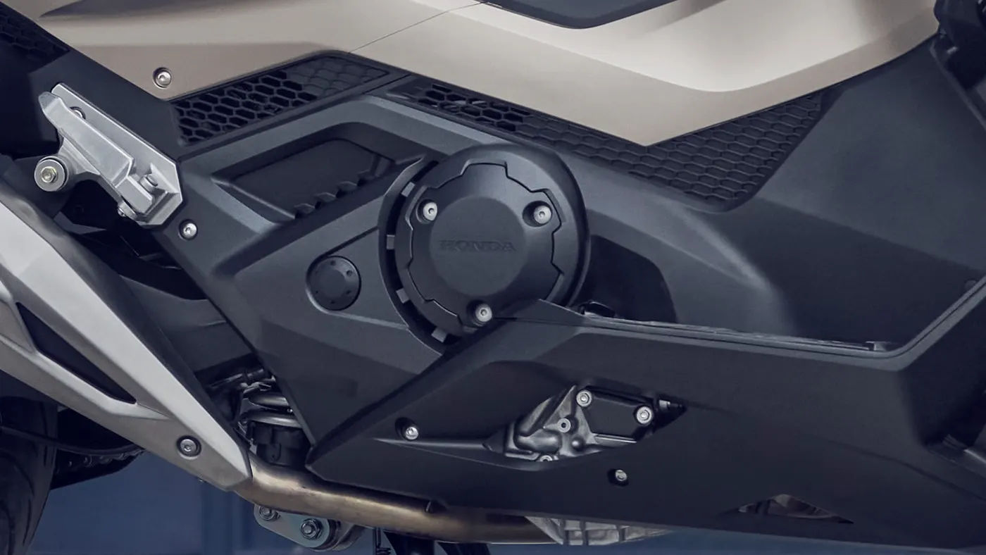 Close-up of the Honda Forza 750 engine casing and lower bodywork