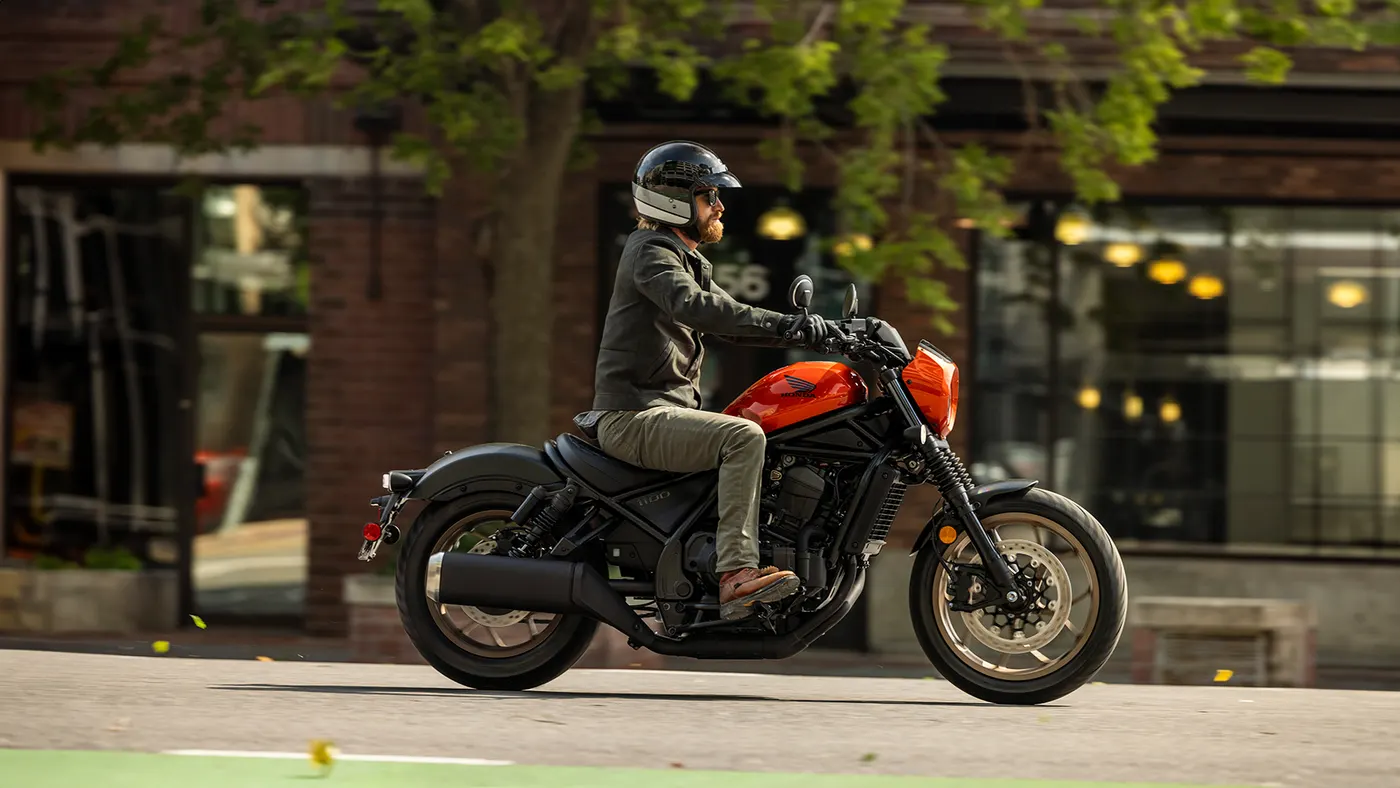 Honda Rebel 1100 with a rider on a city street