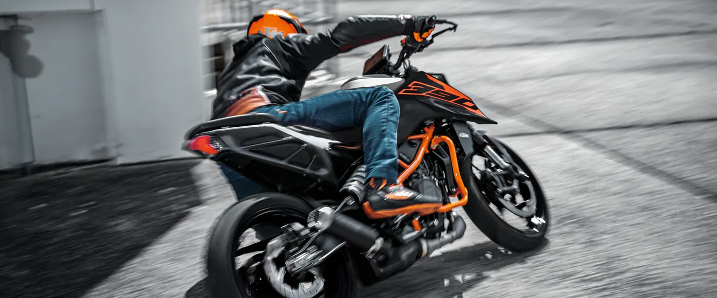 Rider cornering a KTM 390 Duke