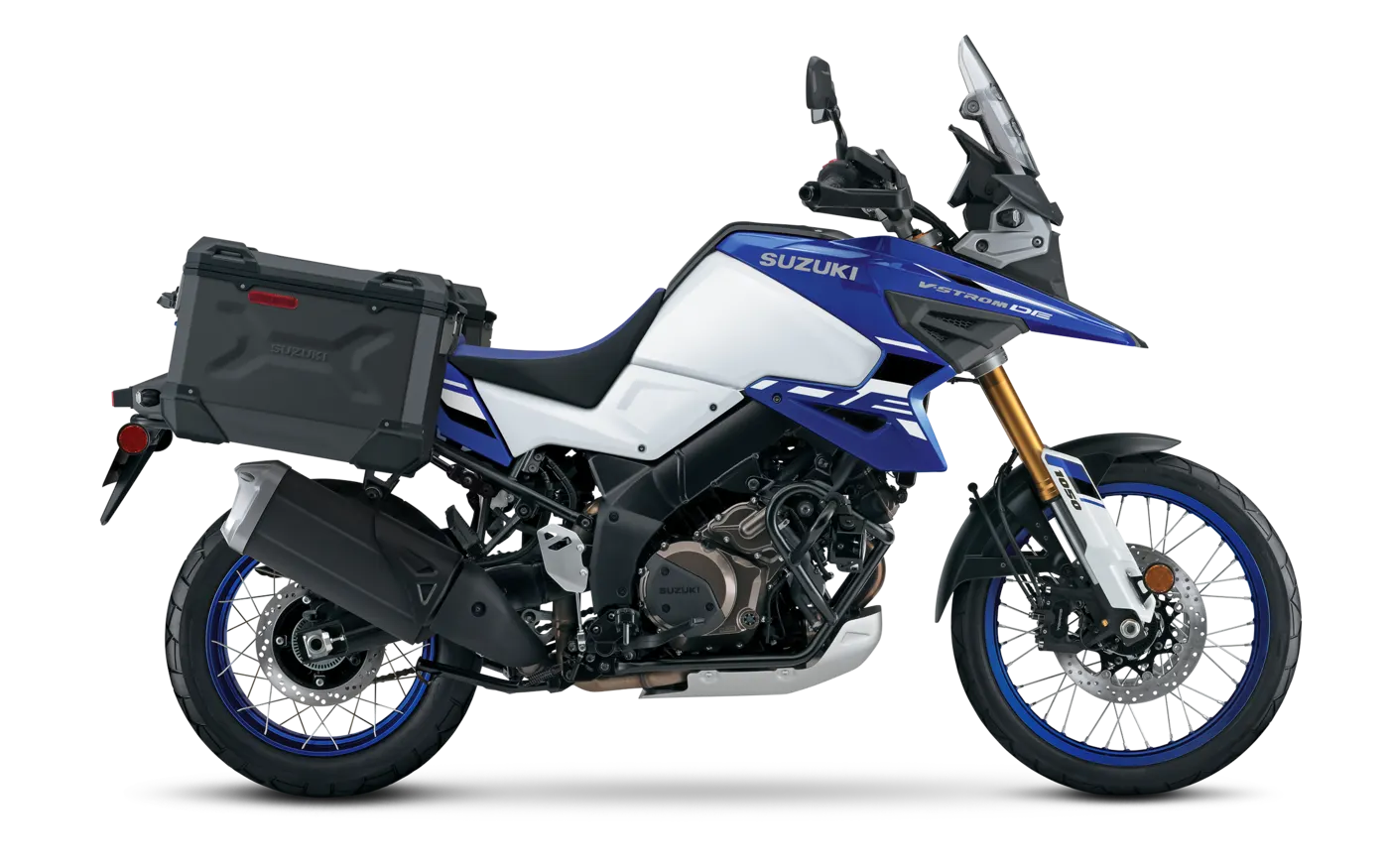 Blue and white Suzuki V-Strom 1050DE with luggage, right side profile
