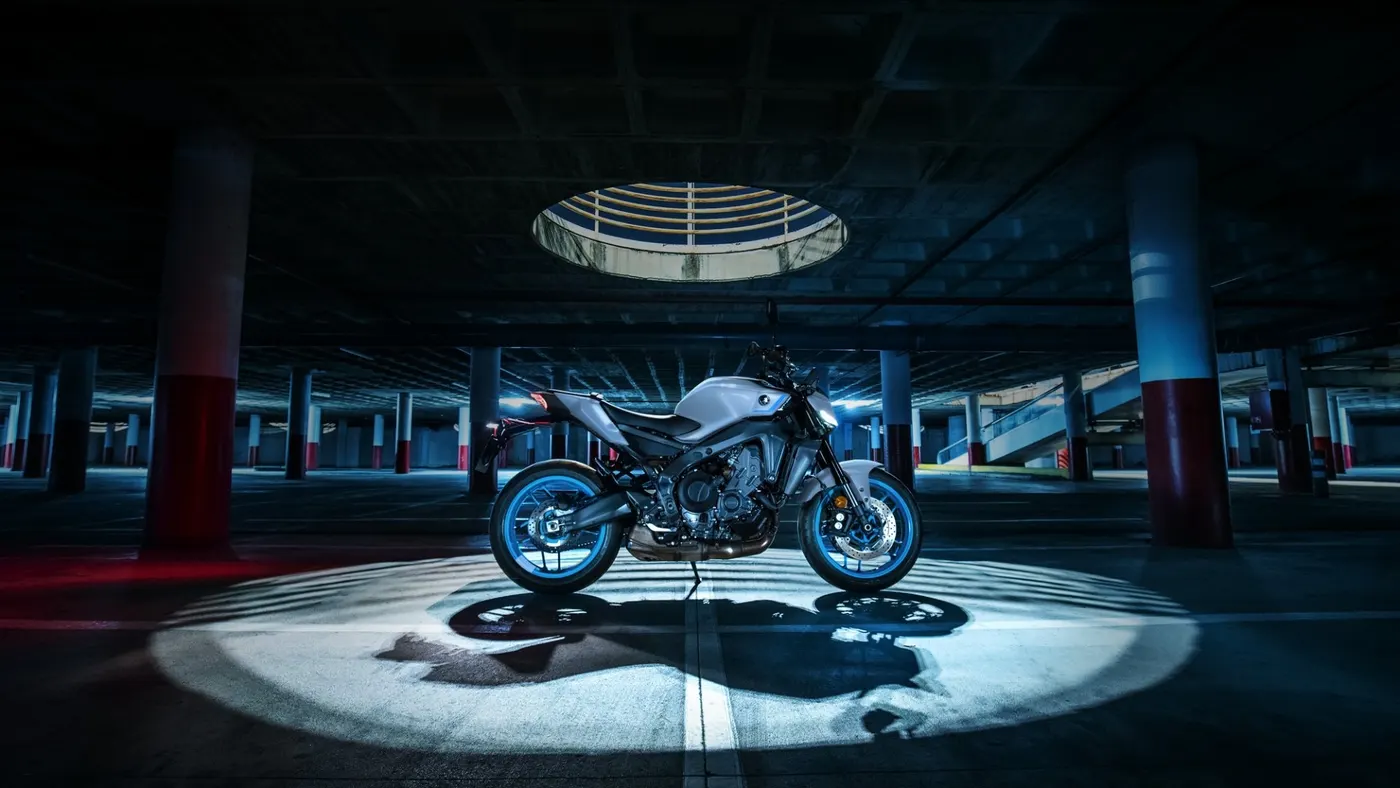 Grey and blue Yamaha MT-09 parked in an underground car park