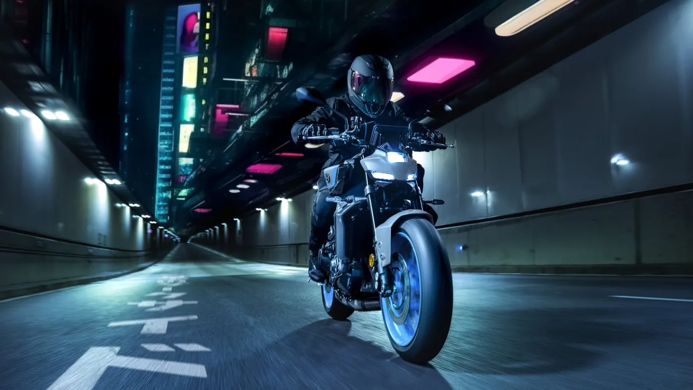 Yamaha MT-09 ridden through a neon-lit tunnel