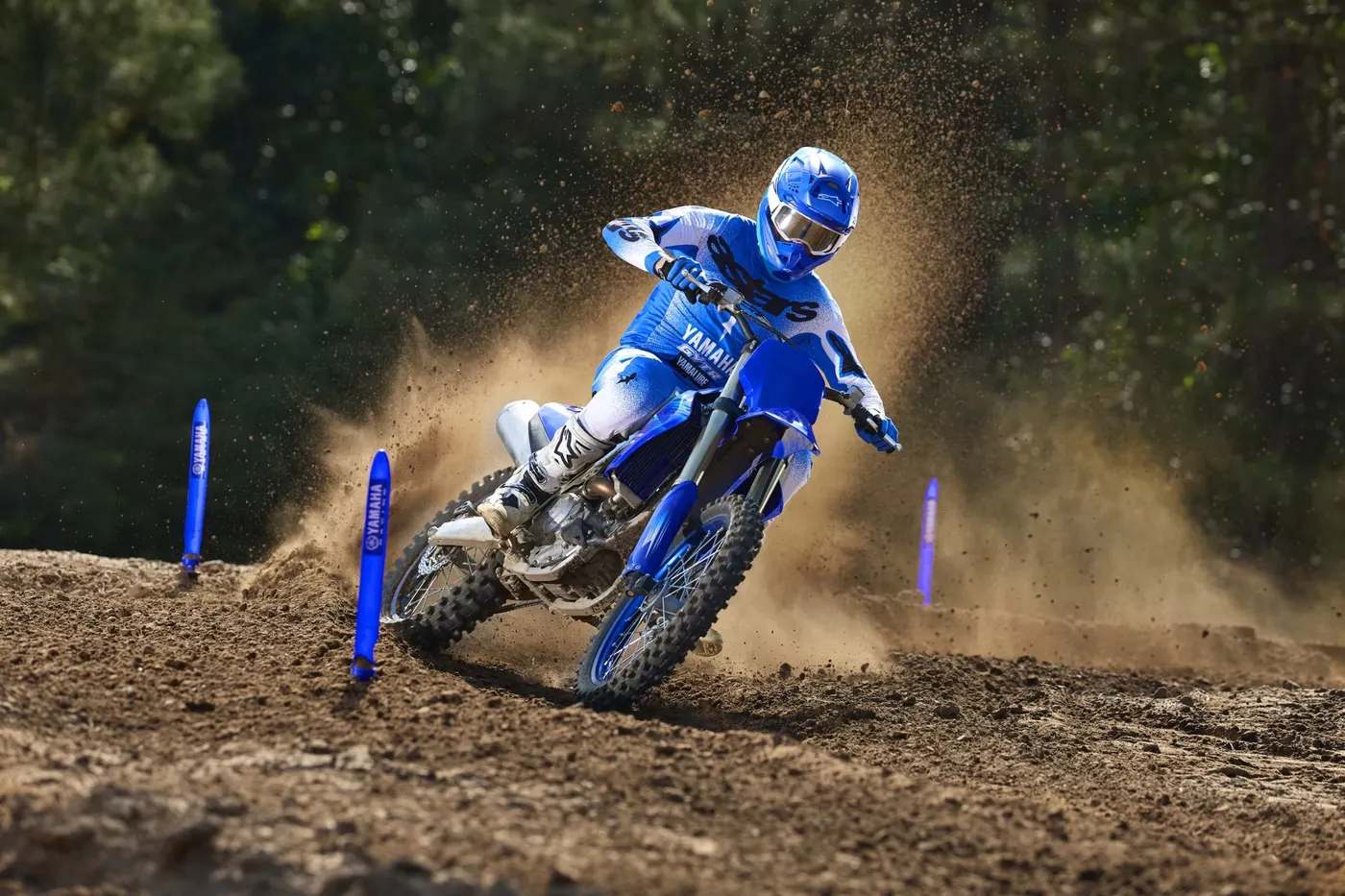 Yamaha YZ450F rider attacking a berm in blue race kit