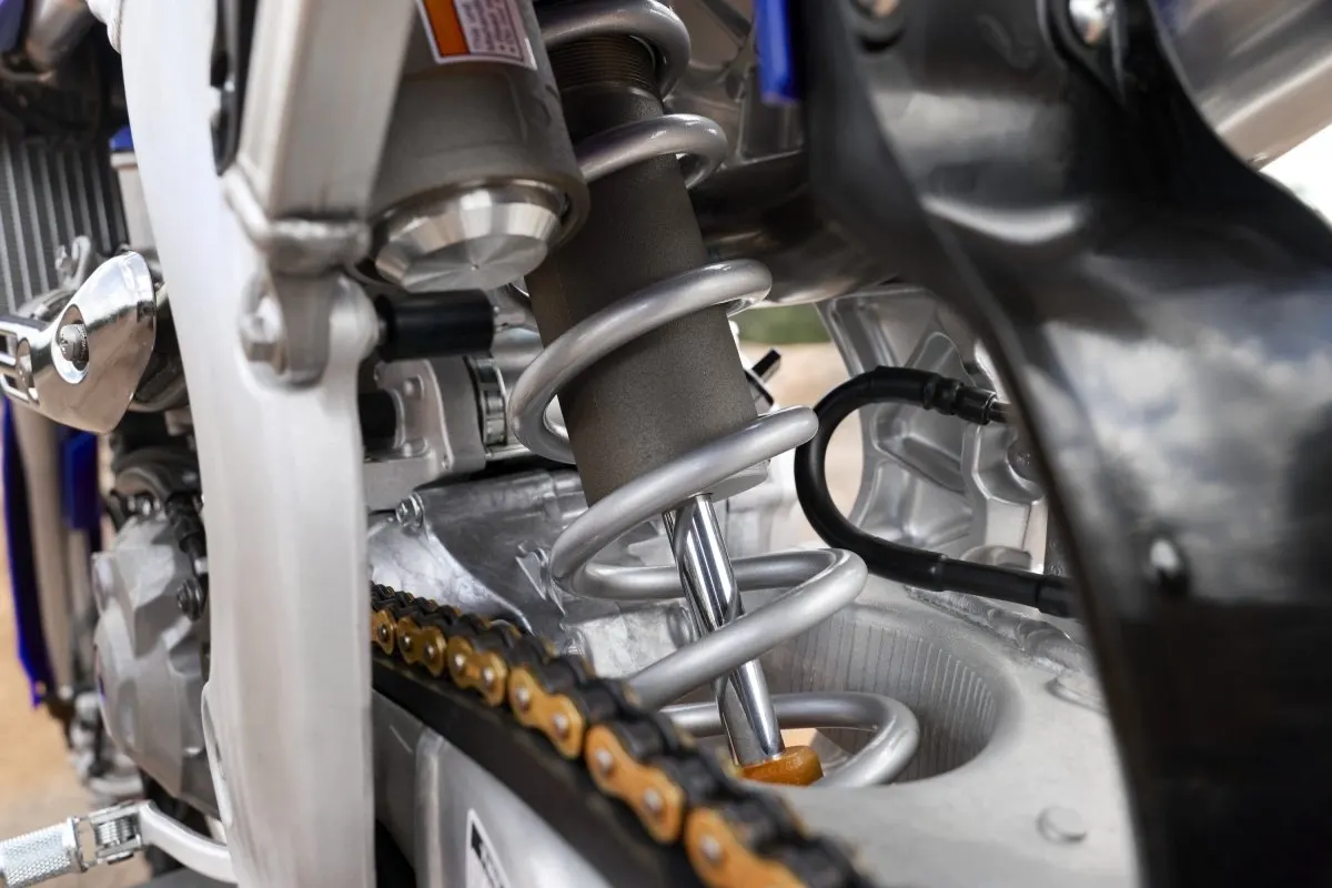 Close-up of the Yamaha YZ450F rear KYB shock and linkage