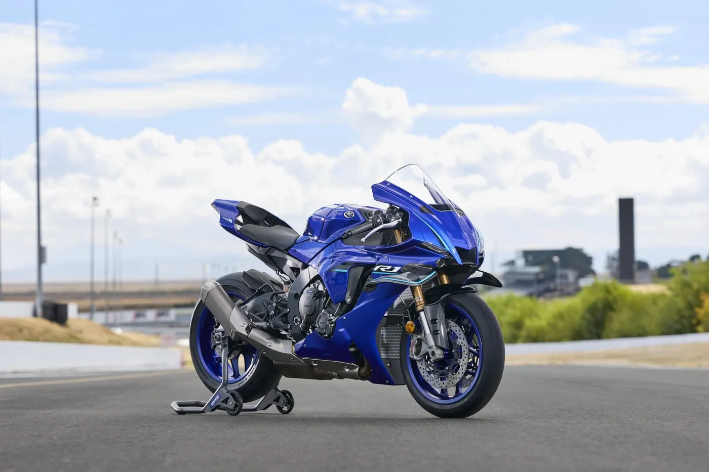 Blue Yamaha YZF-R1 on a race circuit with its winglets and Brembo brakes visible